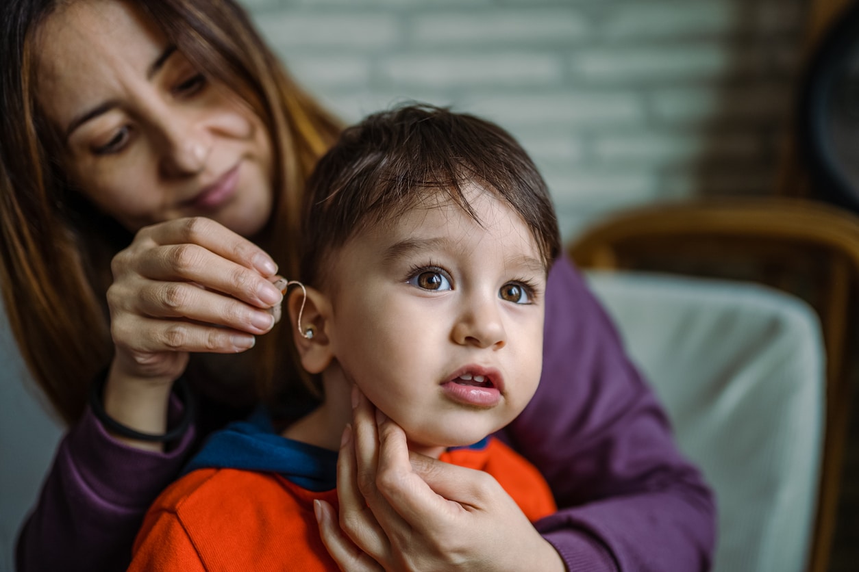 Child with hearing aid