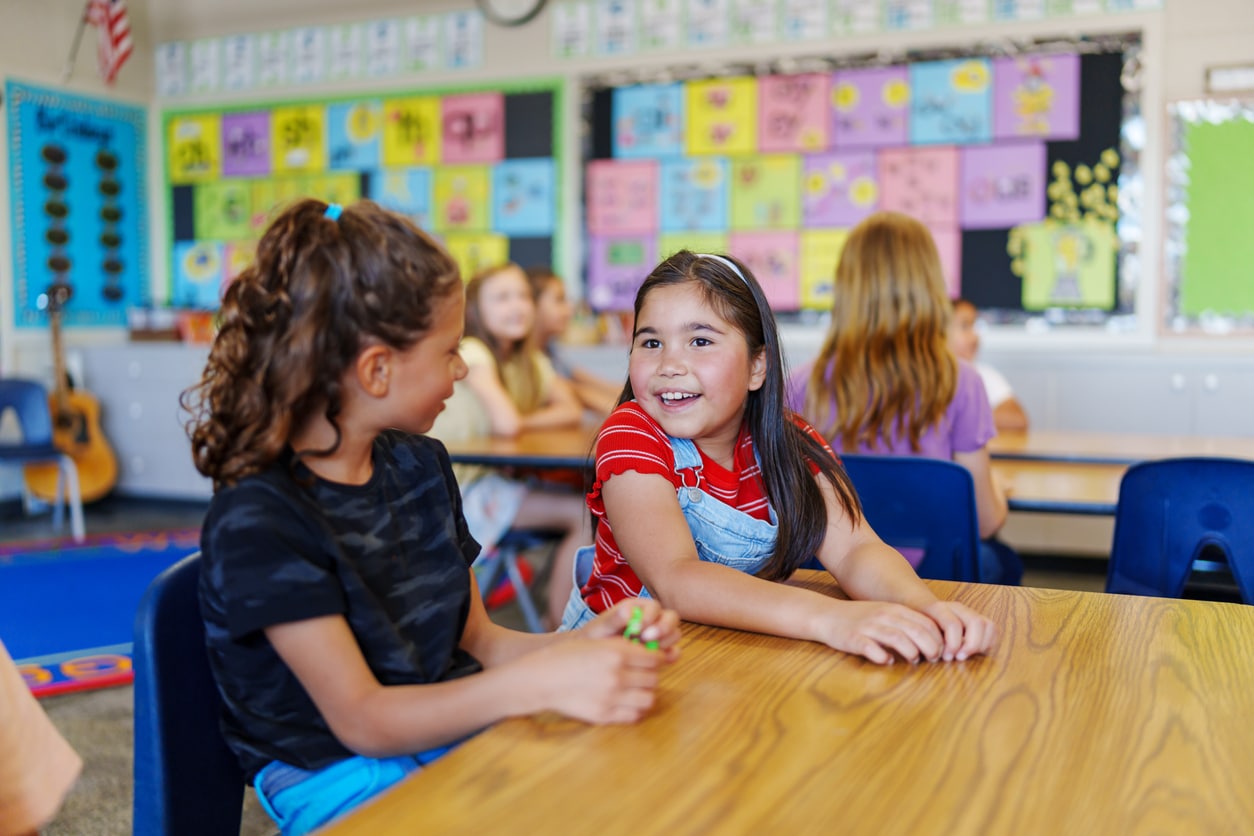 Young Girls Talking in the Classroom